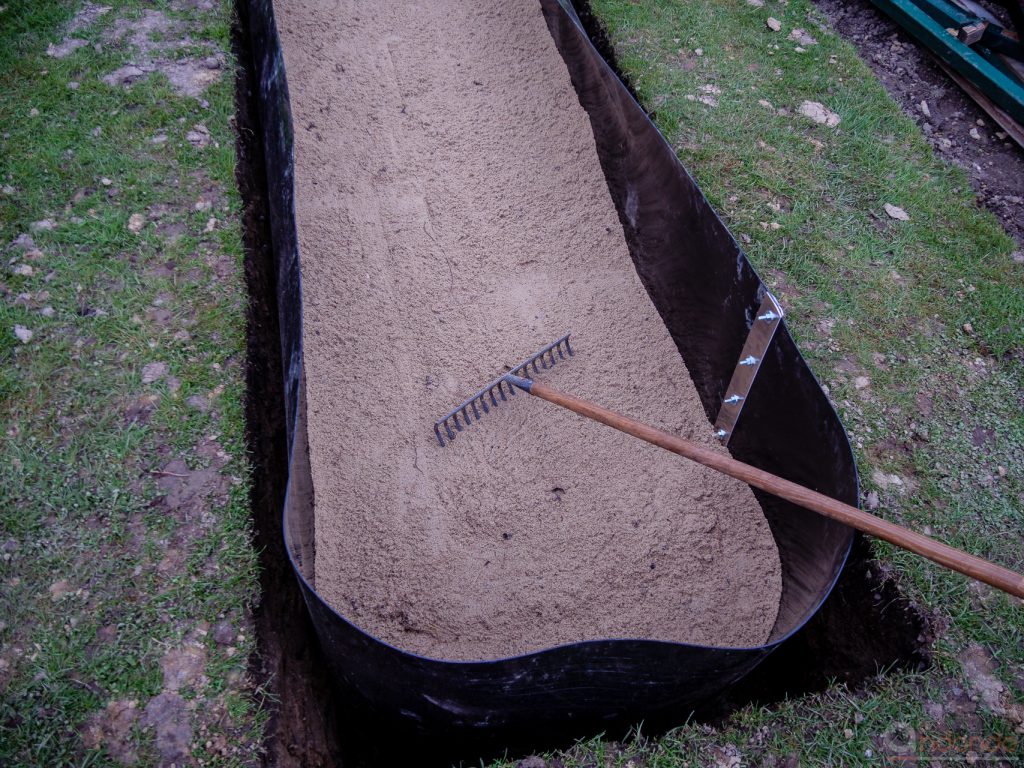 Sandschicht glätten